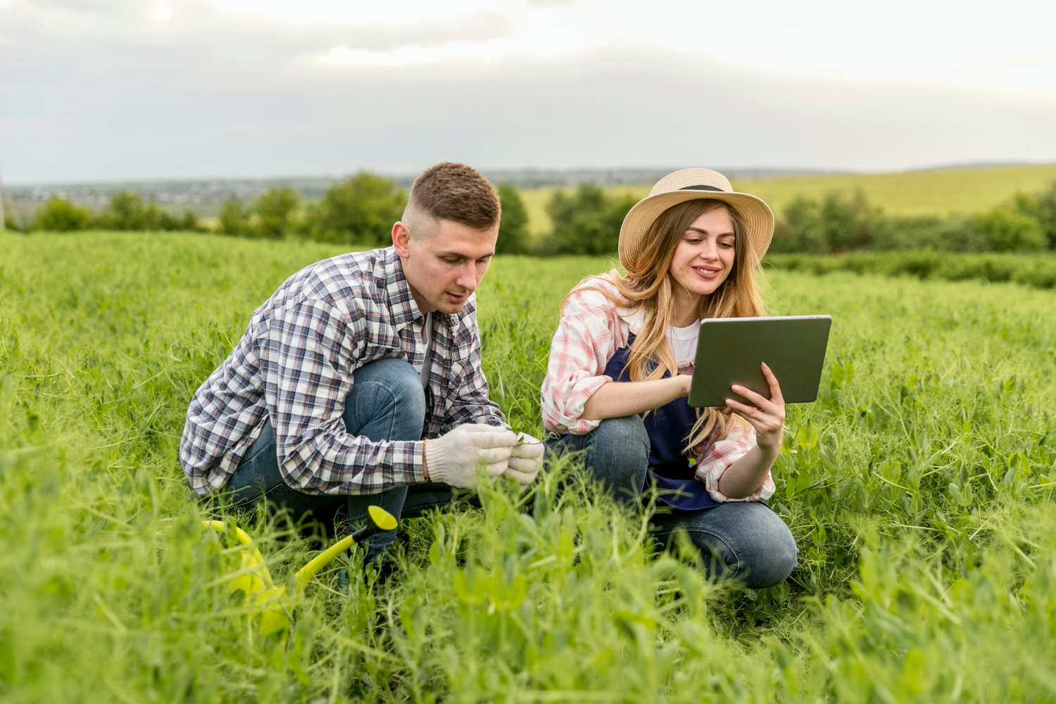 couple-working-farm-with-tablet